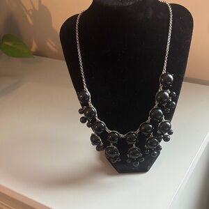 Like new silver and graduated black stones necklace.